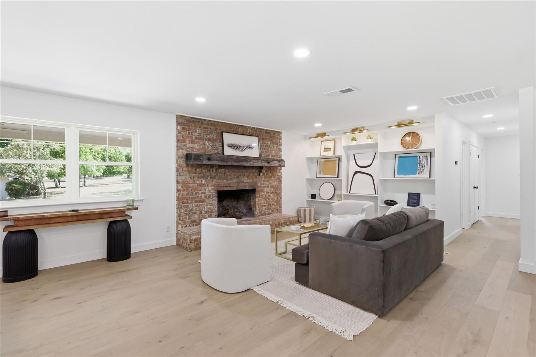 Living room with fireplace staged by JJ Staging in Willow Park